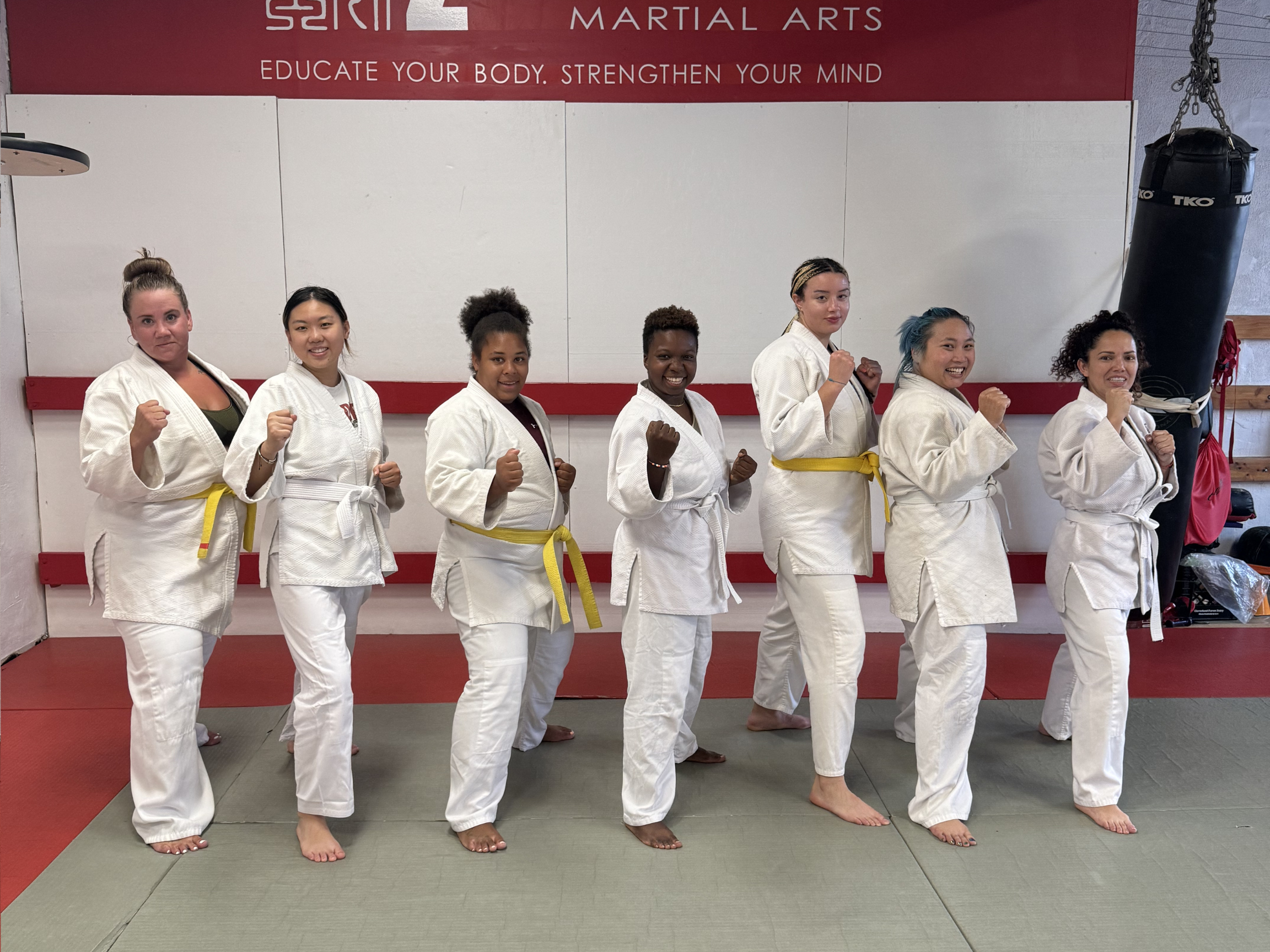 Women practicing martial arts in a supportive women-only class at Zhang Sah Martial Arts, building confidence and strength together
